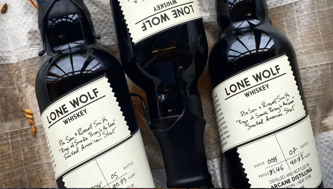 three bottles of lone wolf whiskey