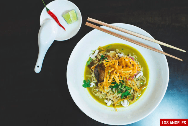 noodle bowls with chopstick and chili